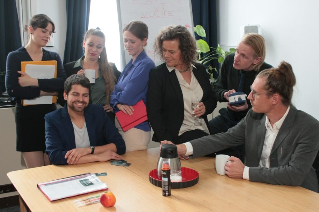 Group of representatives coordinating around a table