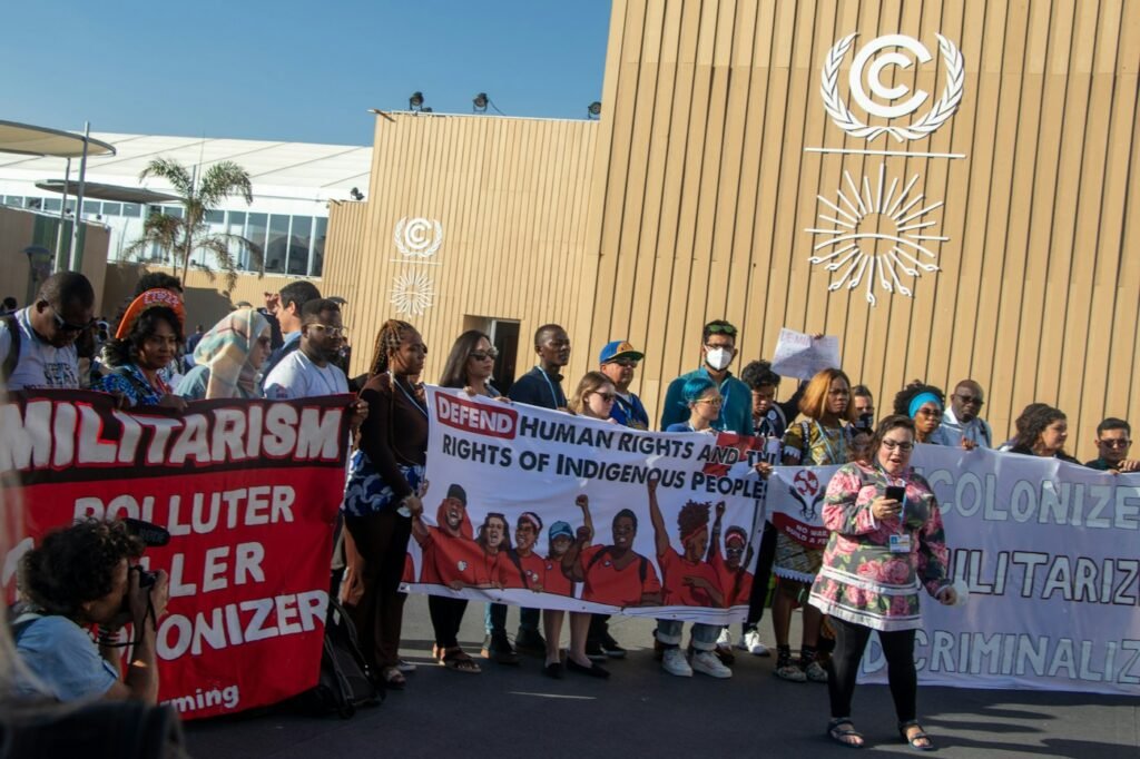 A vibrant group photo of Climate Action Network Arab World members gathered outdoors, united in their mission.